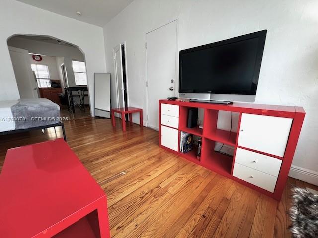 A living room features a red media console, a red coffee table, and hardwood floors — 601 7th St # 4, Miami Beach FL 33139, MIAMI BEACH, FL