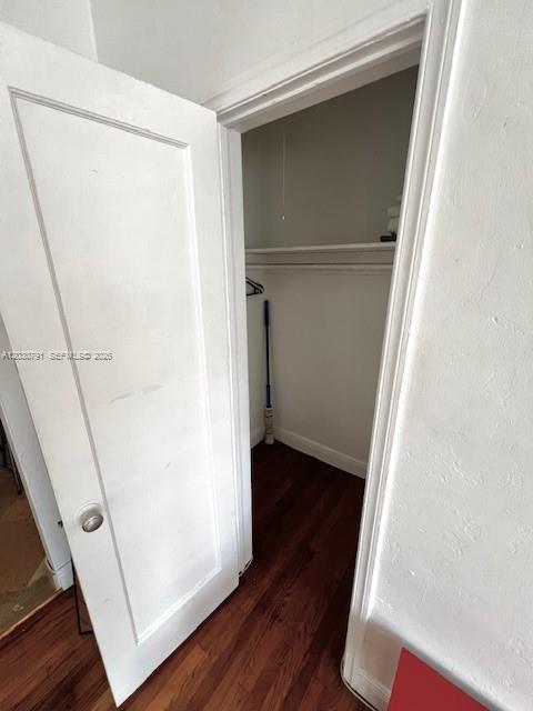 A white door opens into a small closet with a shelf and hardwood flooring — 601 7th St # 4, Miami Beach FL 33139, MIAMI BEACH, FL