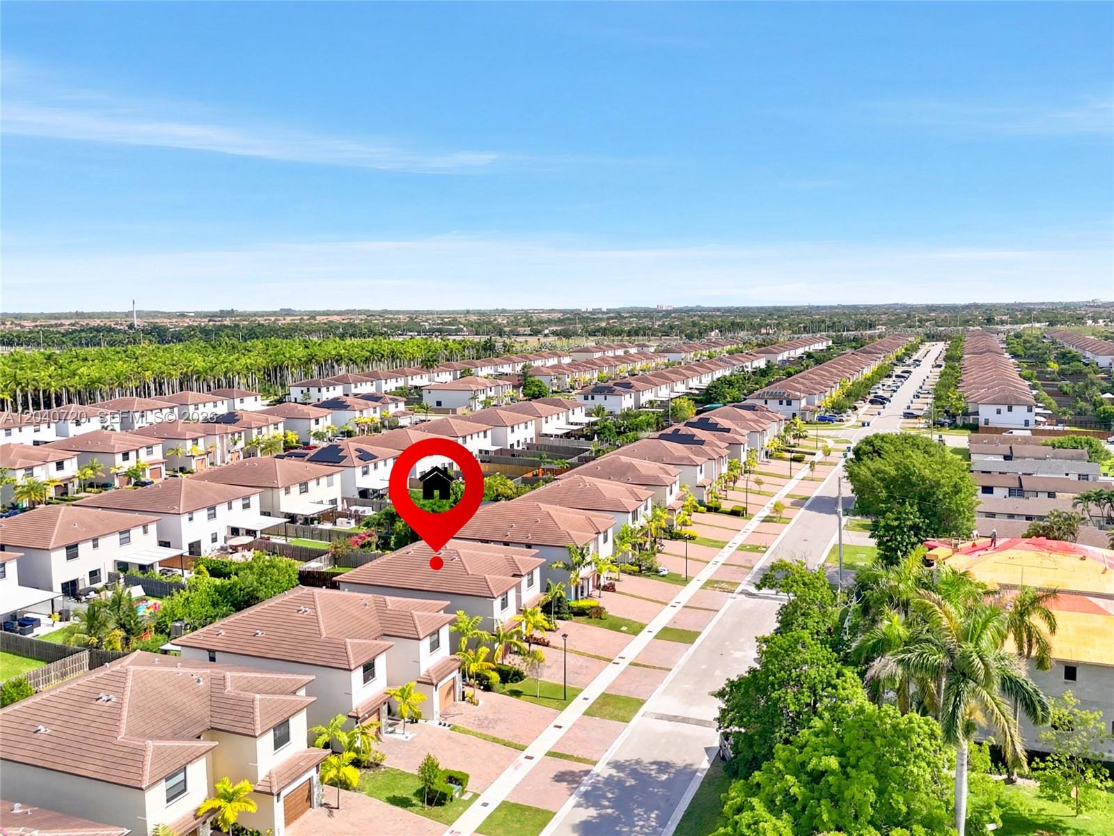 An aerial view shows a suburban neighborhood with rows of houses and a red location marker — HOMESTEAD, FL