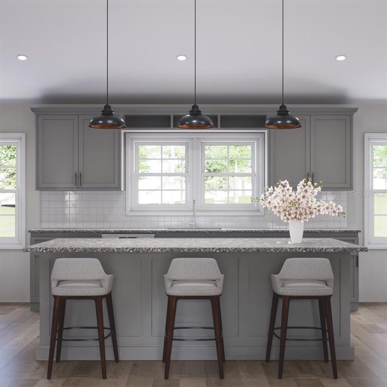 This is a rendering of a kitchen featuring gray cabinets, a speckled island, and pendant lights — 354 HOOT OWL ROAD, SATSUMA, FL