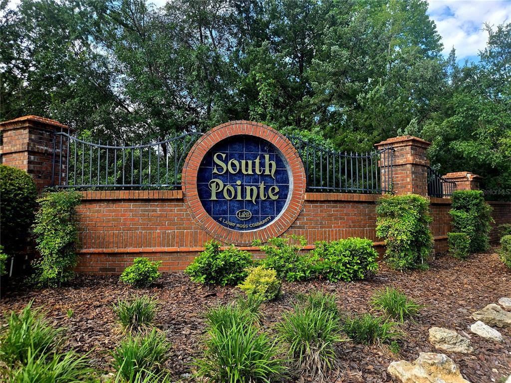 A brick community entrance sign for South Pointe sits in front of trees and landscaping — 1611 NW 121ST WAY, GAINESVILLE, FL