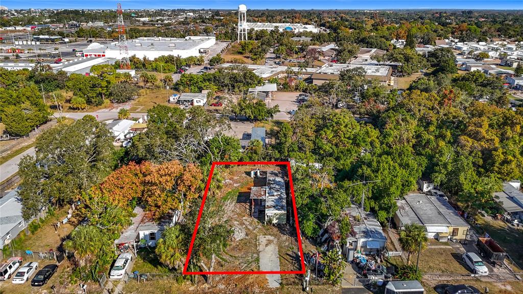 An aerial view shows a rectangular lot with a mobile home outlined in red — 7135 ELIZABETH AVENUE, HUDSON, FL