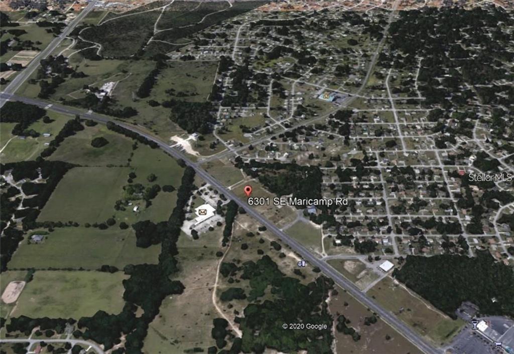 An aerial view of a plot of land located along a highway — 6301 SE MARICAMP ROAD, OCALA, FL