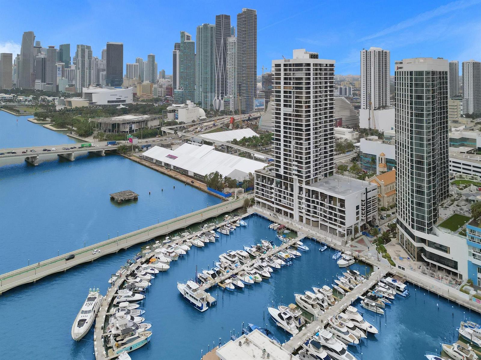 An aerial view of a marina with numerous boats docked beside high-rise buildings in Miami — 555 NE 15th Street, Miami FL 33132, MIAMI, FL