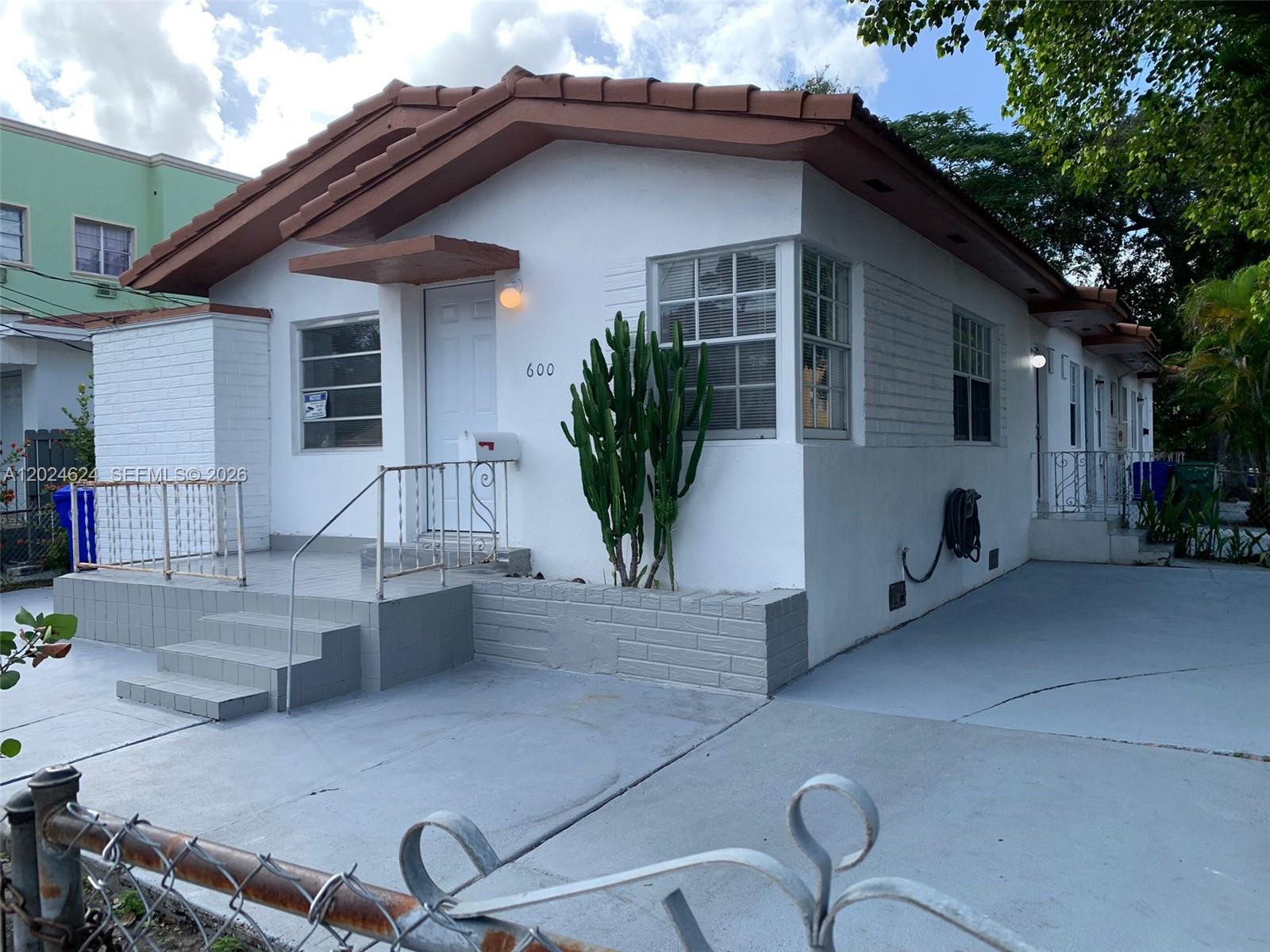 A white, single-story house with a brown tile roof and a cactus in the front — 600 SW 16th Ave, Miami FL 33135, MIAMI, FL