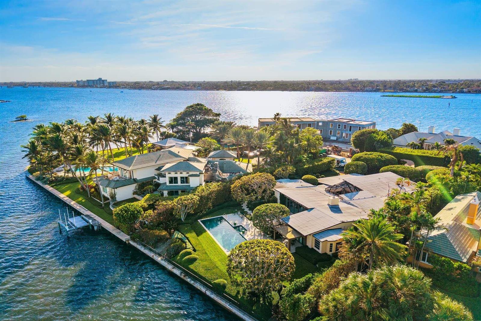 An aerial view of a waterfront estate featuring two houses, swimming pools, and lush landscaping — 748 Island Drive, Palm Beach FL 33480, PALM BEACH, FL