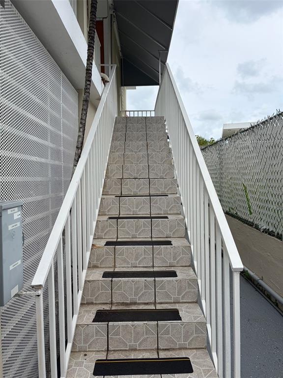 An outdoor staircase with tiled steps and white railings leads to an upper level — 859 CALLE MARGINAL, SAN JUAN, PR