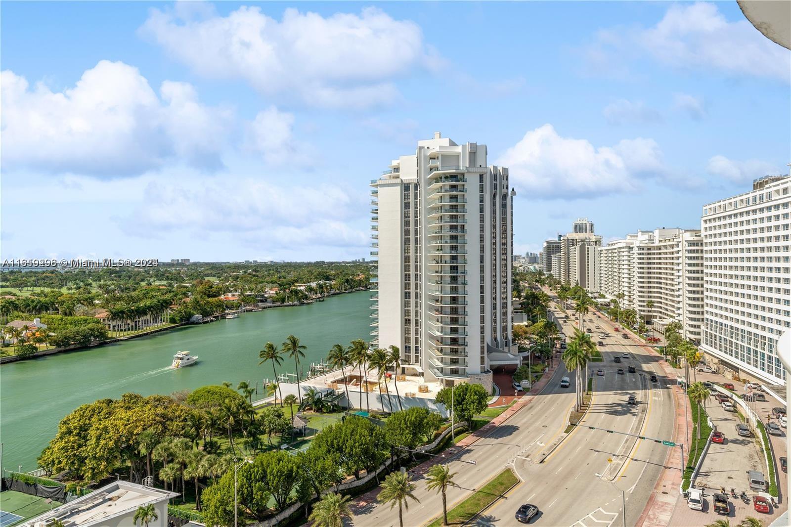 An elevated view shows a waterway, a tall residential building, and a coastal road — 5401 Collins Ave # 1123, Miami Beach FL 33140, MIAMI BEACH, FL