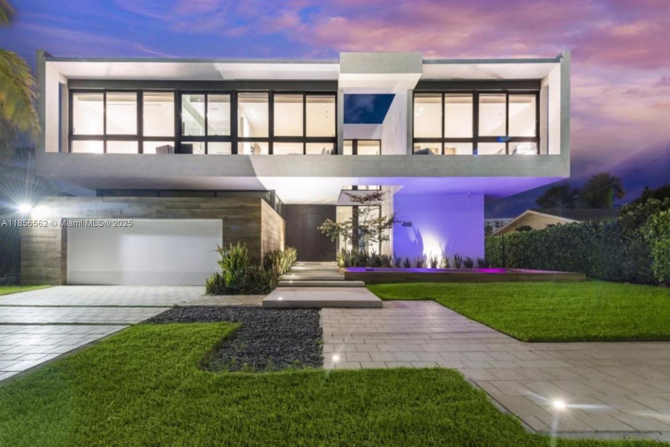 A modern two-story house features a flat roof, large glass windows, and a paved driveway — 418 Sunset Dr, Hallandale Beach FL 33009, HALLANDALE BEACH, FL