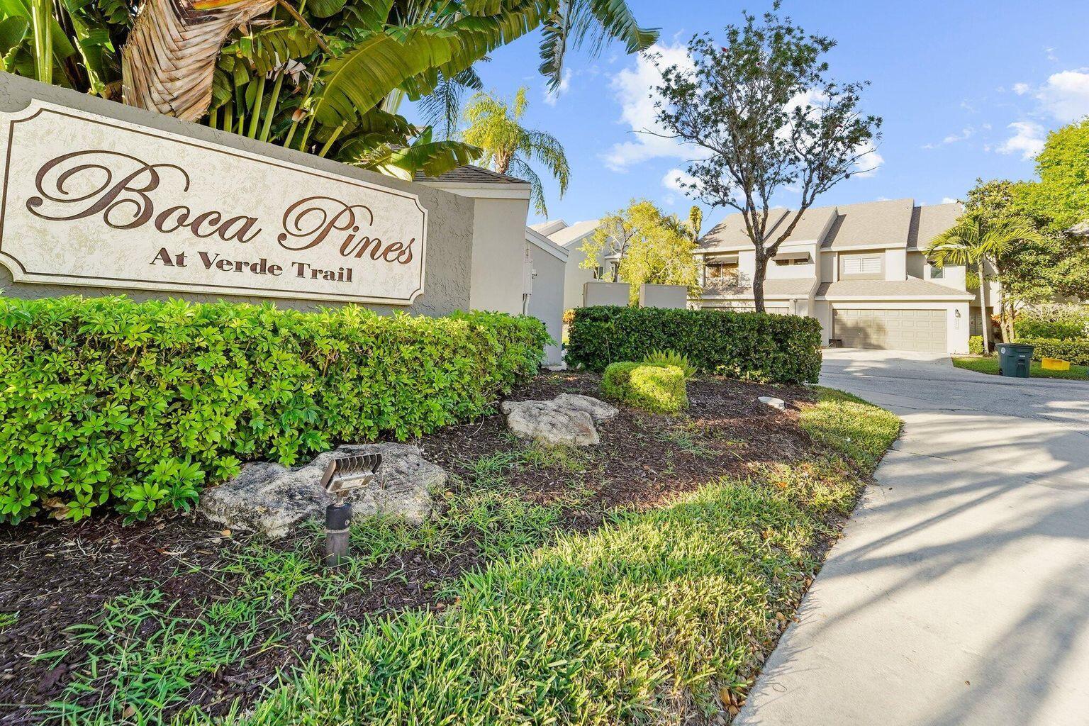 A sign for Boca Pines at Verde Trail stands in front of a residential building — 6750 Boca Pines Trail # D, Boca Raton FL 33433, BOCA RATON, FL