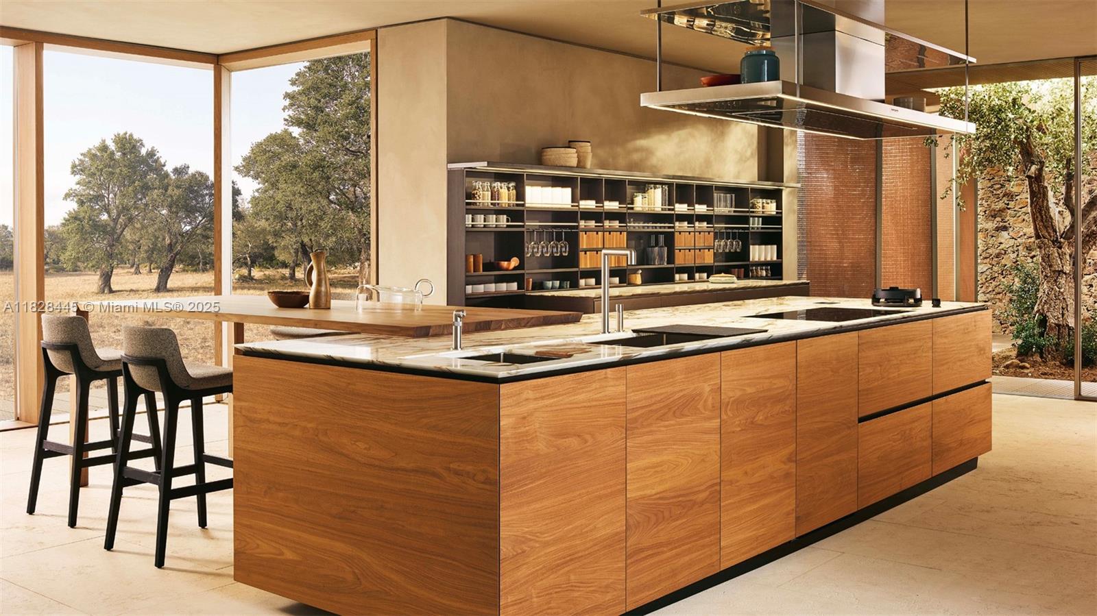 This kitchen features a large wooden island, marble countertops, and floor-to-ceiling windows overlooking trees — 15307 Persimmon Ave, Delray Beach FL 33446, DELRAY BEACH, FL