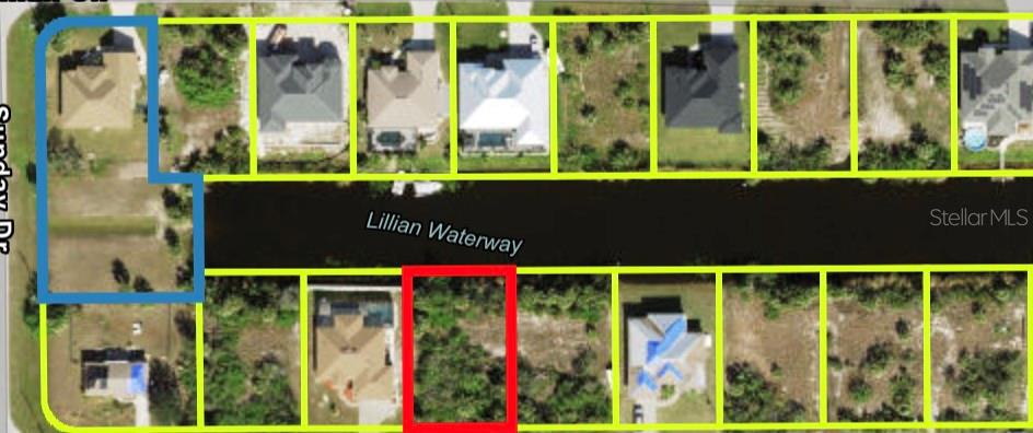 This aerial map shows residential lots along a waterway, with one specific lot highlighted in red — 14408 FORT MYERS AVENUE, PORT CHARLOTTE, FL