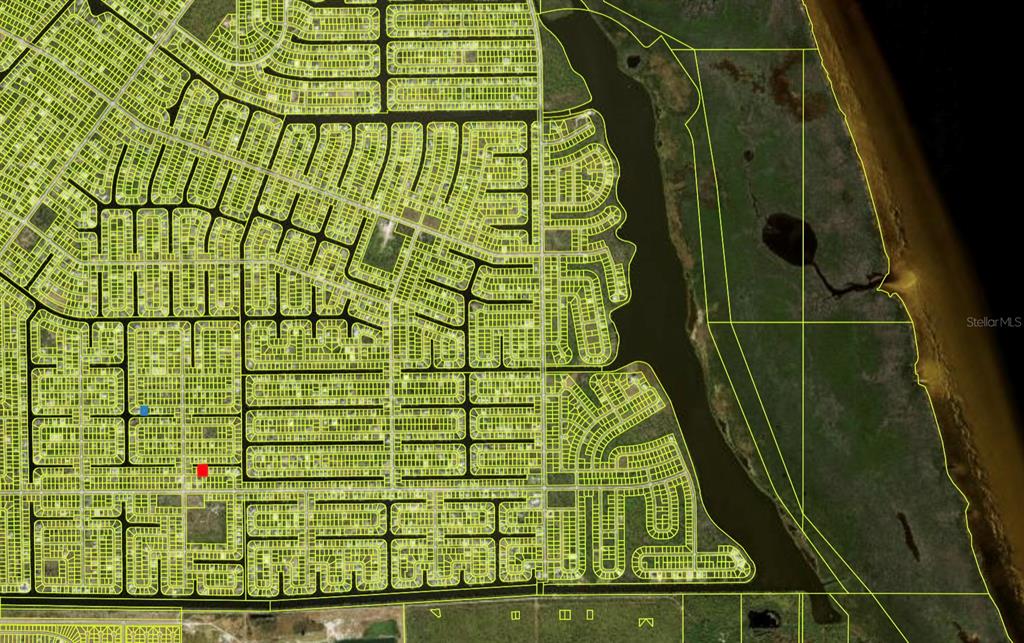 This is a satellite map showing a residential neighborhood grid adjacent to a waterway — 14408 FORT MYERS AVENUE, PORT CHARLOTTE, FL