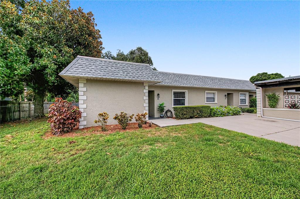 A single-story house with a gray shingled roof and a concrete driveway — 3526 TEESIDE DRIVE, NEW PORT RICHEY, FL