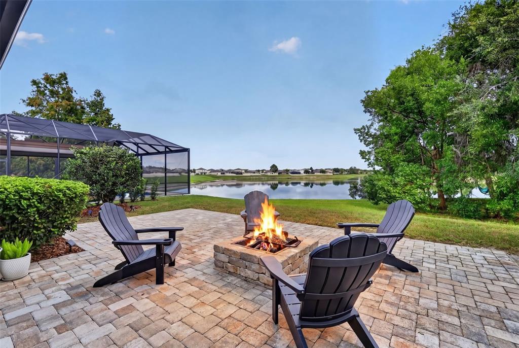 A two-story suburban house with tan siding, a front-facing garage, and a landscaped front yard — 13470 NEWPORT SHORES DRIVE, HUDSON, FL