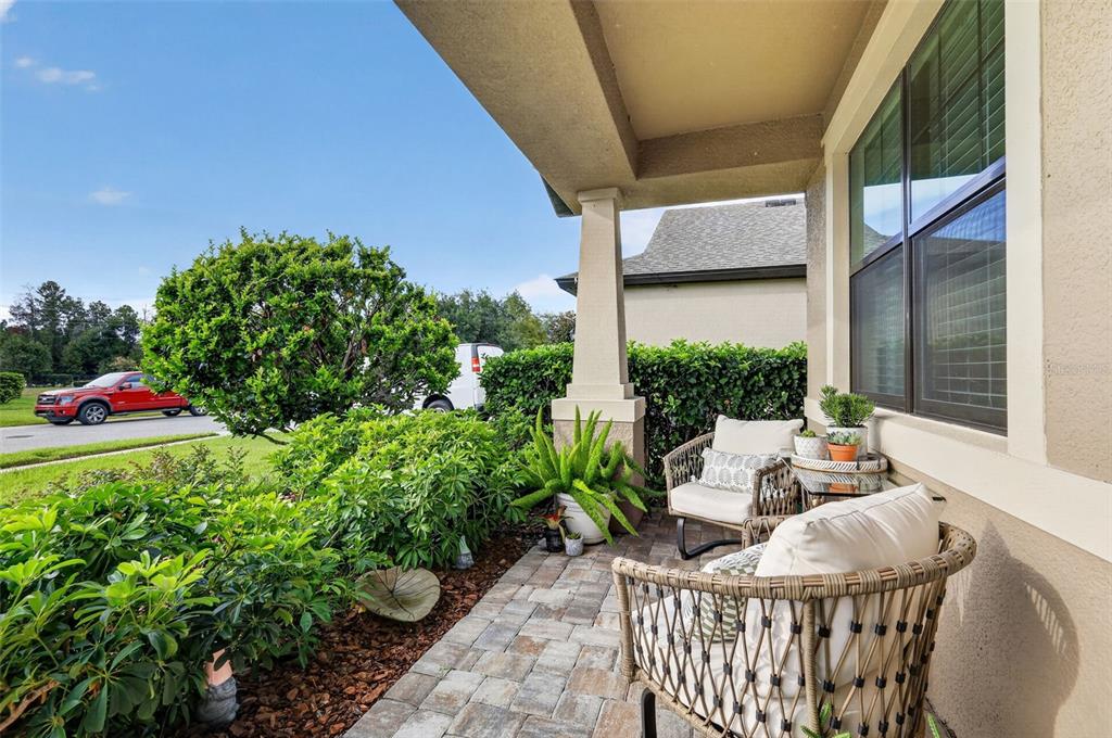 A two-story suburban house with tan siding, a front porch, and a two-car garage — 13470 NEWPORT SHORES DRIVE, HUDSON, FL