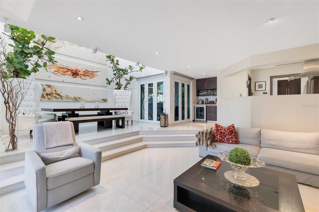 A sunken living room features white tile floors, a dining area, and a wet bar — 2008 ESPAÑA STREET, SAN JUAN, PR