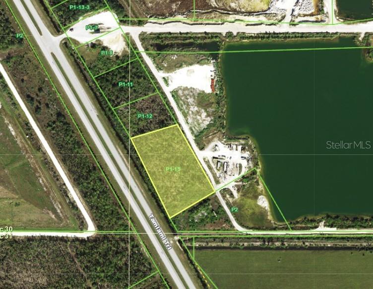 This is an aerial map showing a highlighted parcel of land adjacent to a highway — 16540 TAMIAMI TRAIL, PUNTA GORDA, FL