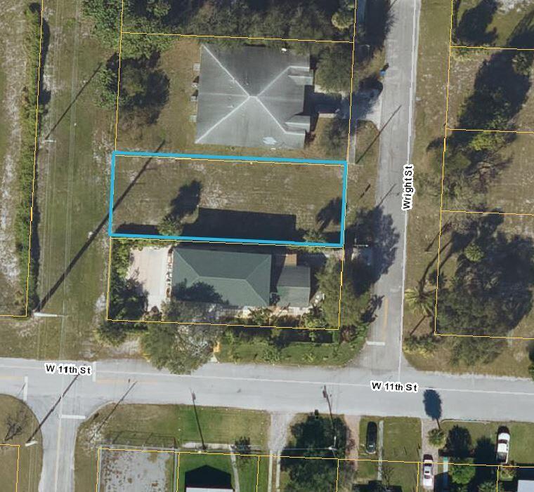 This aerial map shows a vacant rectangular lot outlined in blue between two residential properties — 1109 Wright Street, Riviera Beach FL 33404, RIVIERA BEACH, FL