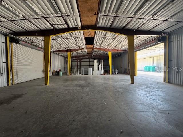 An interior view of a large, open warehouse space with concrete floors and metal beams — 2251 TOPLINE WAY UNIT 6, BROOKSVILLE, FL
