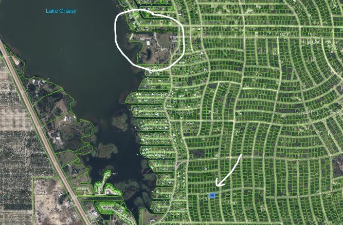 An aerial map shows a residential neighborhood near Lake Grassy with a highlighted property lot — 233 MOON GLOW COURT, LAKE PLACID, FL
