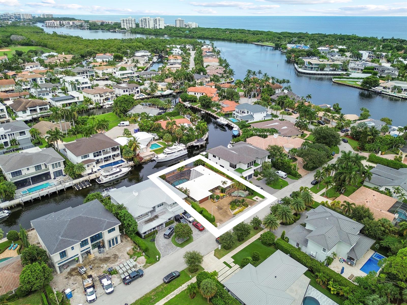 An aerial view shows a waterfront residential property with a pool and boat dock — 531 Silver Lane, Boca Raton FL 33432, BOCA RATON, FL