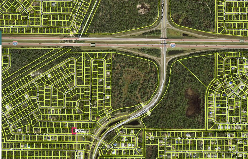 This is an aerial map showing residential lots and streets near an interstate highway interchange — LADY SLIPPER AVENUE, NORTH PORT, FL