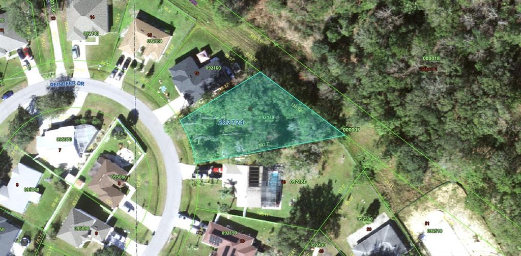 This is an aerial map showing a highlighted residential lot in a suburban neighborhood — 656 REINDEER DRIVE, POINCIANA, FL