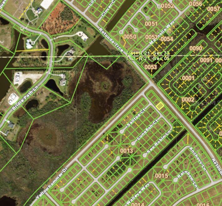This is a map showing residential lots, streets, and undeveloped land in a suburban area — 12076 SEA-ROBIN LANE, PLACIDA, FL