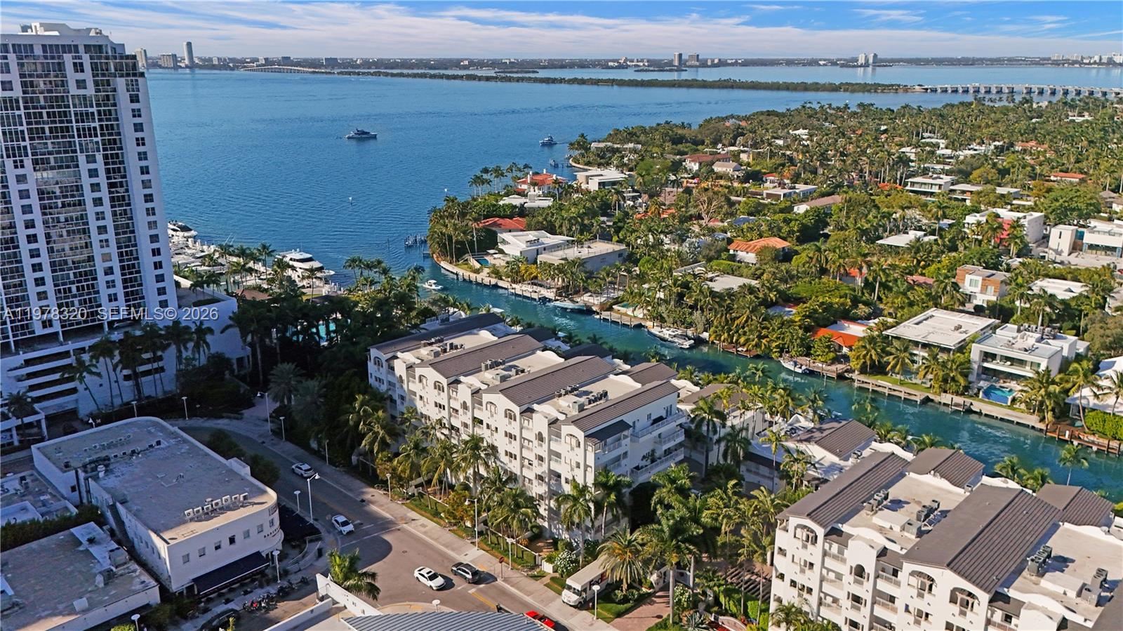 An aerial view shows a waterfront residential area with canals, boats, and multi-story buildings — 1415 Sunset Harbour Dr # 202, Miami Beach FL 33139, MIAMI BEACH, FL