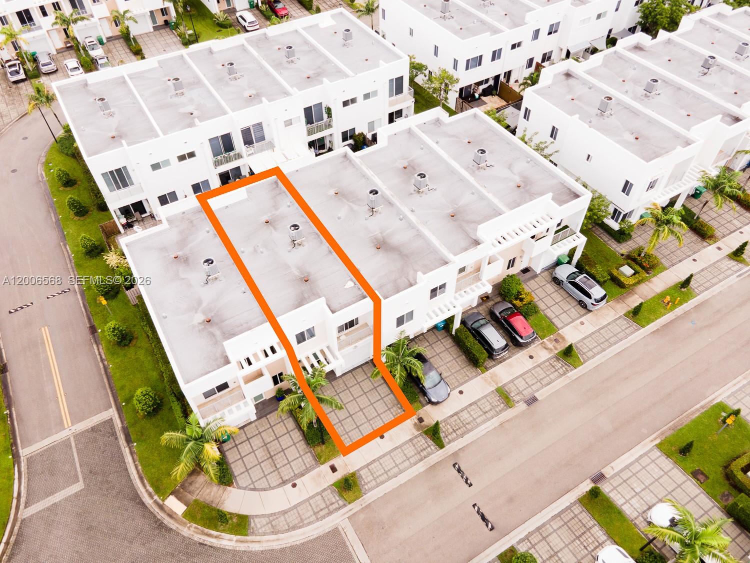 An aerial view shows a white townhouse highlighted in orange within a residential complex — 10279 NW 72nd St, Doral FL 33178, DORAL, FL