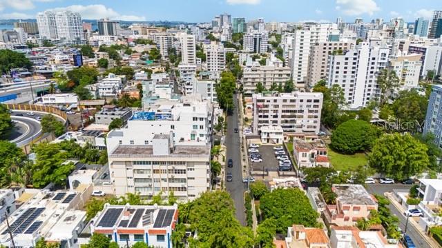 An aerial view of a dense urban neighborhood with multi-story apartment buildings and city streets — 1422 WILSON AVENUE AVENUE UNIT 5B, SAN JUAN, PR