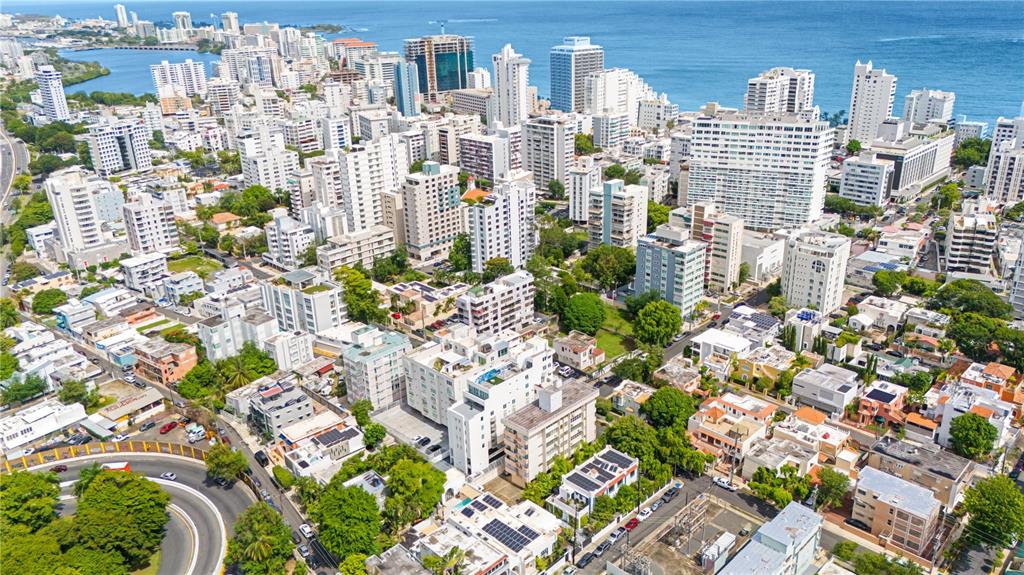 An aerial view of a dense urban coastal city with many high-rise apartment buildings — 1422 WILSON AVENUE AVENUE UNIT 5B, SAN JUAN, PR