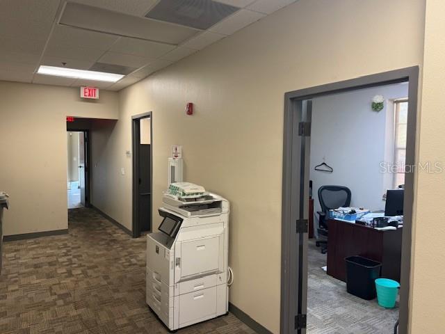 A hallway with a printer leads to an office with a desk and chair — 326 N MILLS AVENUE, ORLANDO, FL