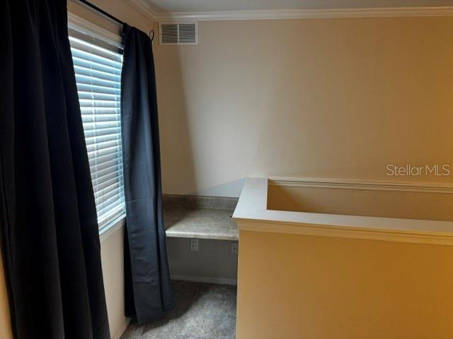 A small built-in desk area is located in a carpeted room next to a window — 4850 51ST STREET W UNIT 4207, BRADENTON, FL
