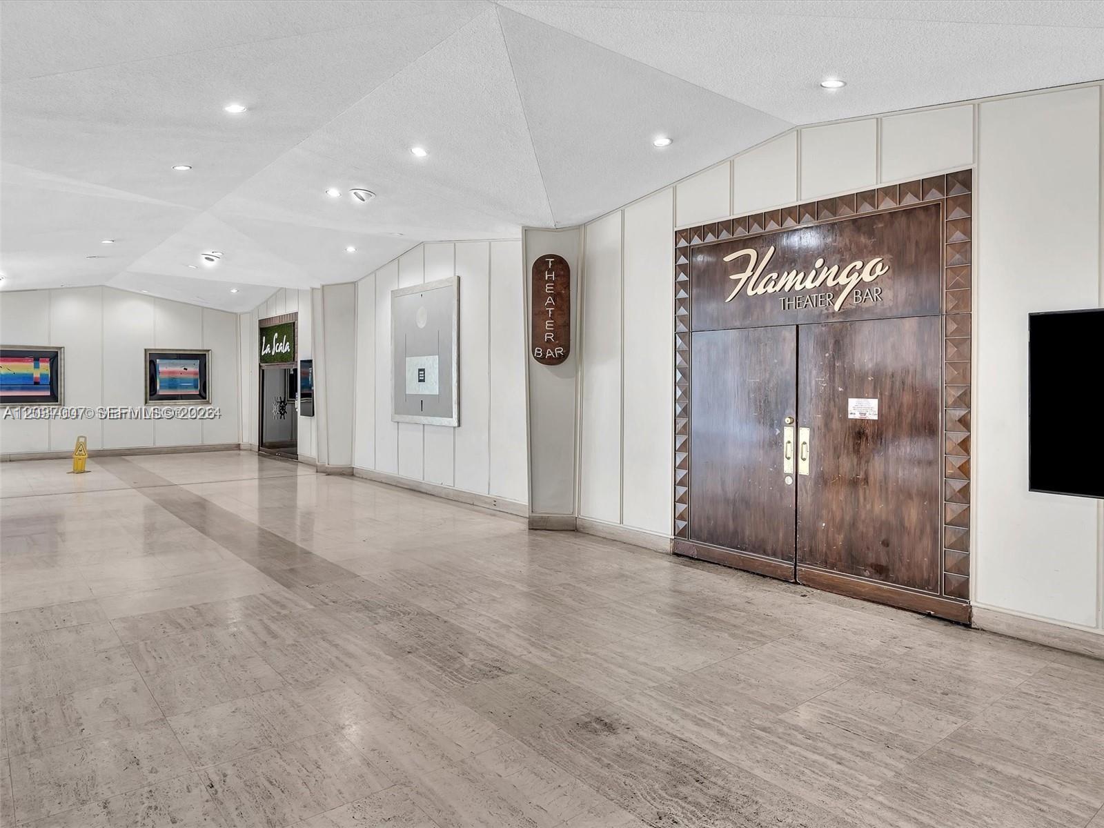 A gym features multiple treadmills, weight machines, and dumbbells on a rubber floor — 905 Brickell Bay Dr # 623, Miami FL 33131, MIAMI, FL