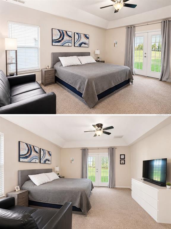 This bedroom features a tray ceiling, a gray bed, a black sofa, and glass doors — 2526 HOLLY BERRY CIRCLE, CLERMONT, FL