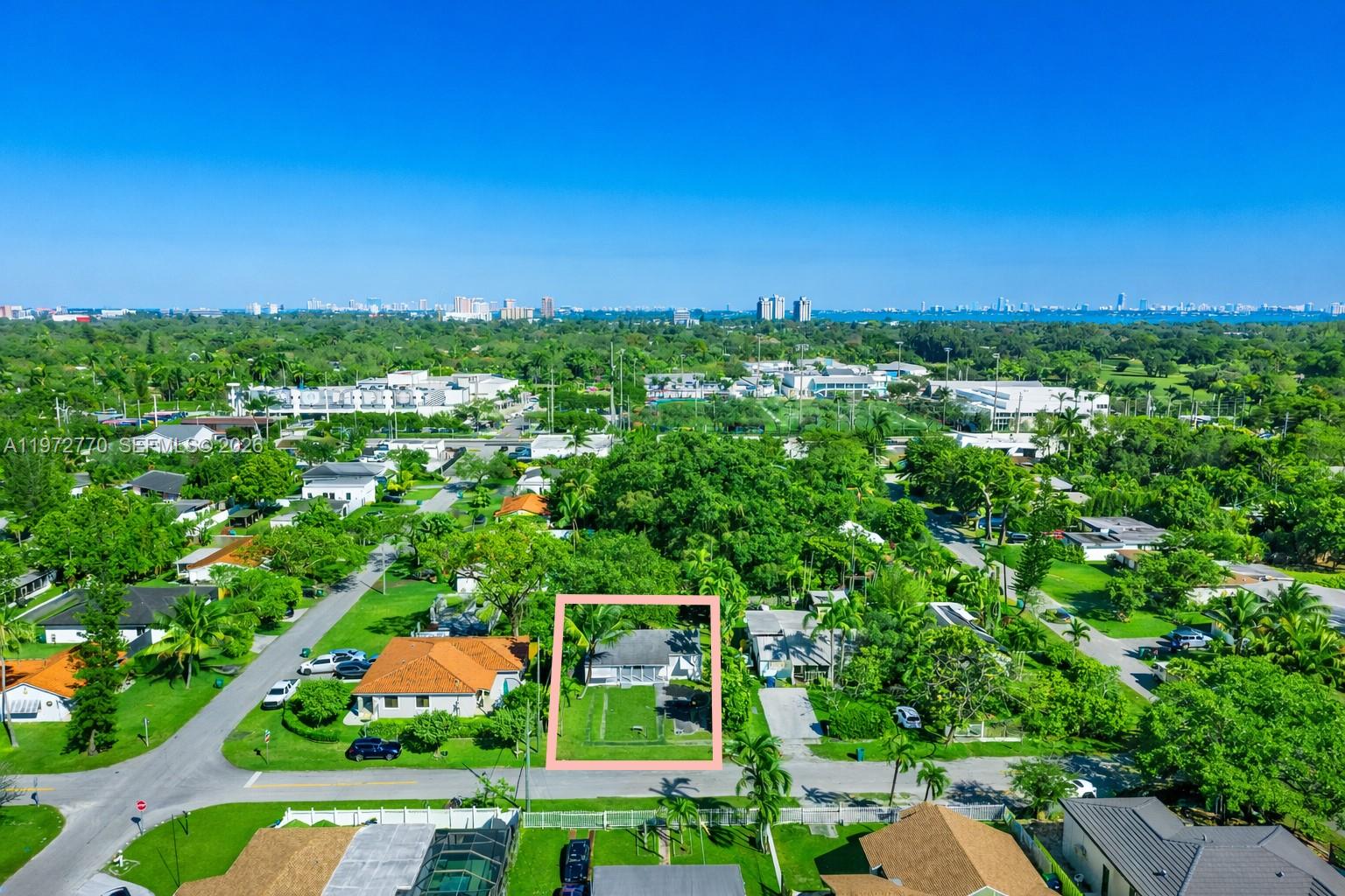 An aerial view shows a single-story house with a yard outlined in pink — 10821 NE 5th Ave, Miami FL 33161, MIAMI, FL