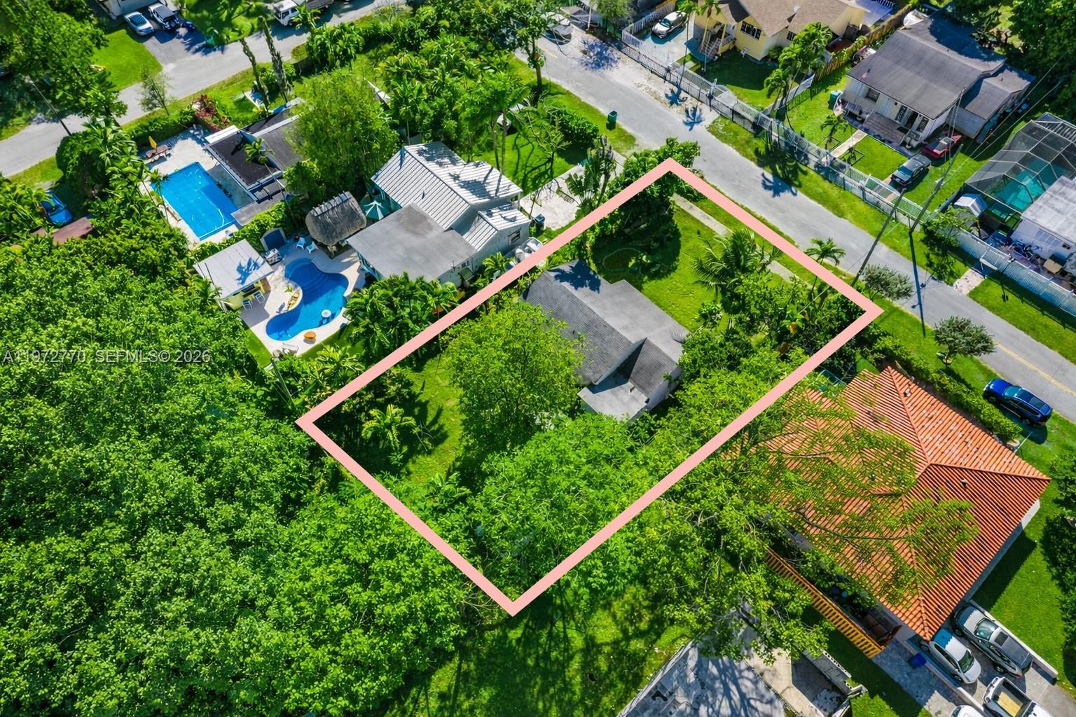 An aerial view shows a house with a large, tree-filled yard outlined in pink — 10821 NE 5th Ave, Miami FL 33161, MIAMI, FL