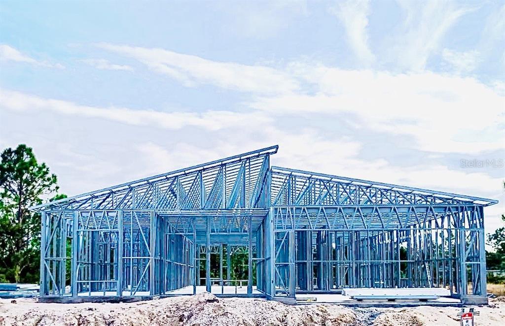 The exterior of a house under construction features a light-gauge steel framing structure — 12123 PLATANO DRIVE, PUNTA GORDA, FL