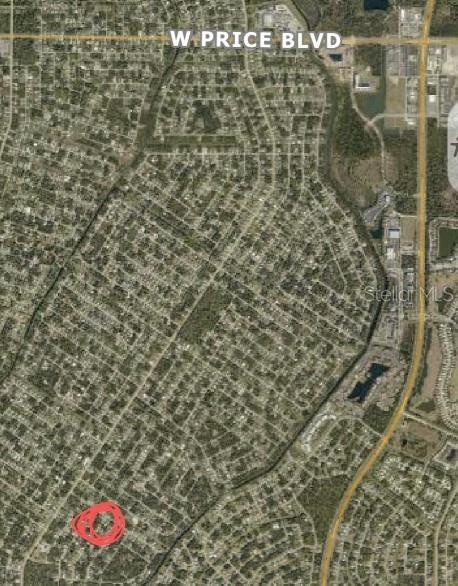 This is an aerial map showing a residential neighborhood with a specific lot circled in red — TALISMAN TERRACE, NORTH PORT, FL
