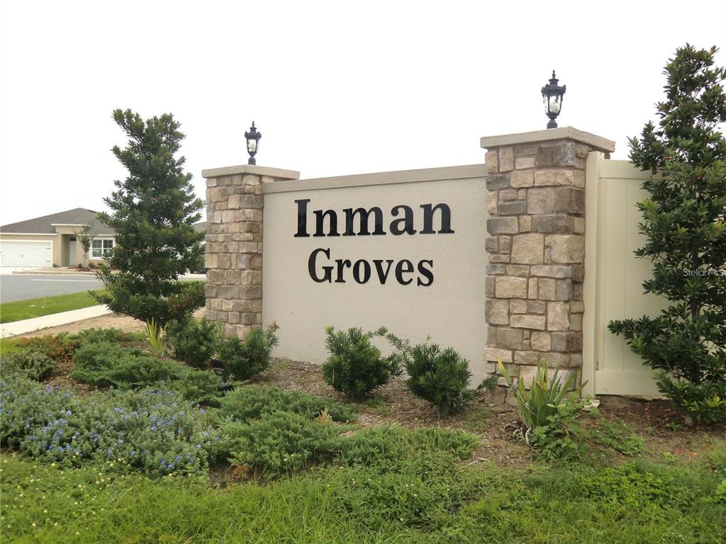 A stone and stucco monument sign displays the name Inman Groves in a landscaped area — 172 INMAN BOULEVARD, WINTER HAVEN, FL