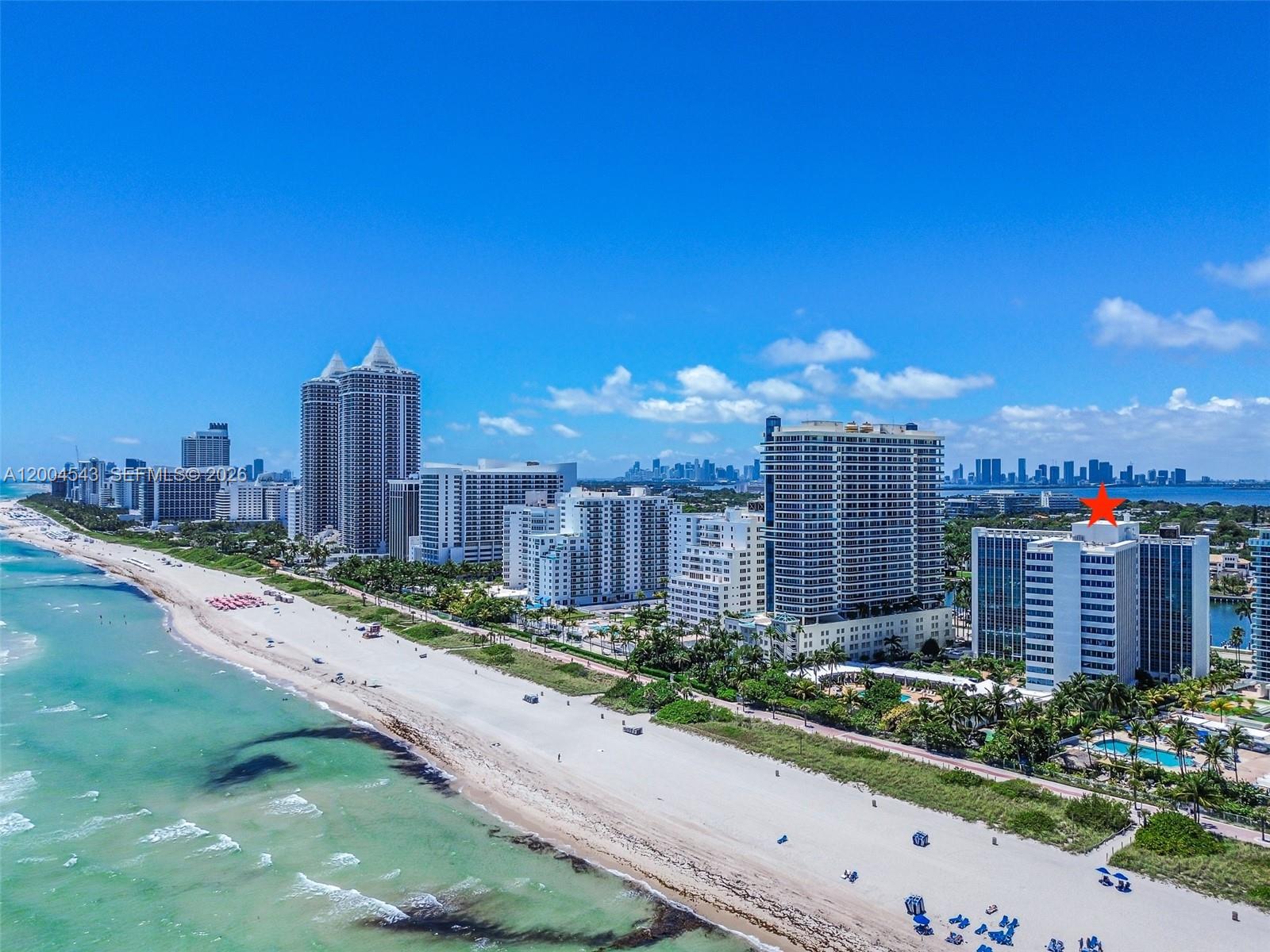 An aerial view of a beachfront city skyline with a red star marking a building — 5055 Collins Ave # 3K, Miami Beach FL 33140, MIAMI BEACH, FL
