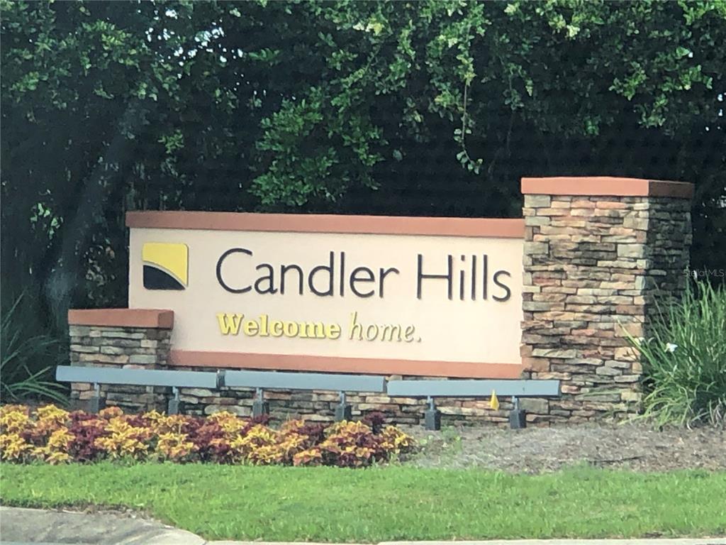 A stone and stucco monument sign for Candler Hills sits in front of green trees — 8722 SW 83RD LOOP, OCALA, FL