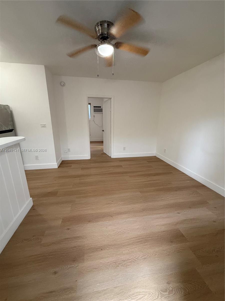 This room features light wood-look flooring, white walls, and a ceiling fan — 469 SW 3rd St # 4, Miami FL 33130, MIAMI, FL
