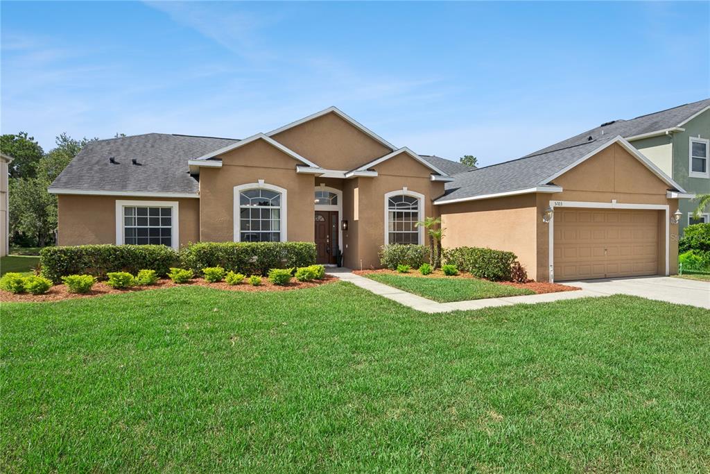 An aerial view shows a residential house with a pool, enclosed by a red border — 5703 AUTUMN CHASE CIRCLE, SANFORD, FL