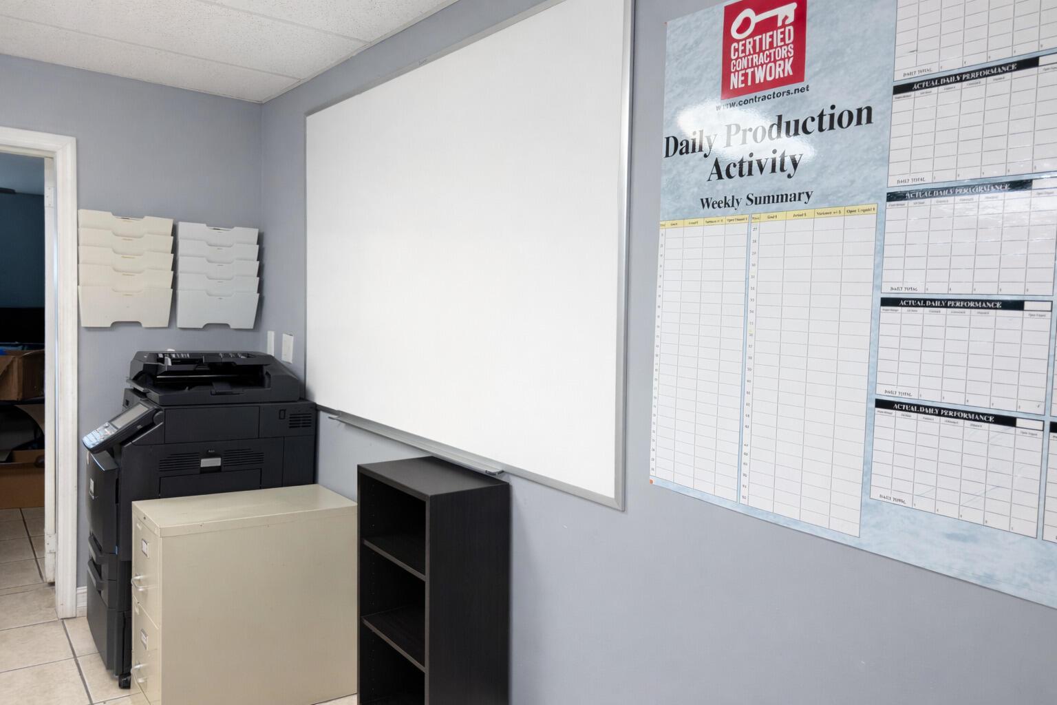 An office space features a large whiteboard, a printer, a filing cabinet, and a wall chart — 4560 Us Highway 1, Vero Beach FL 32967, VERO BEACH, FL