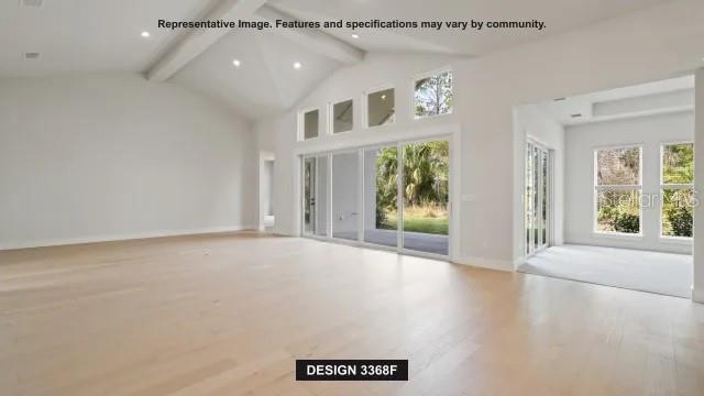 This rendering shows a spacious living room with light wood floors and vaulted ceilings — 19794 ROLLING RIDGE DRIVE, BROOKSVILLE, FL