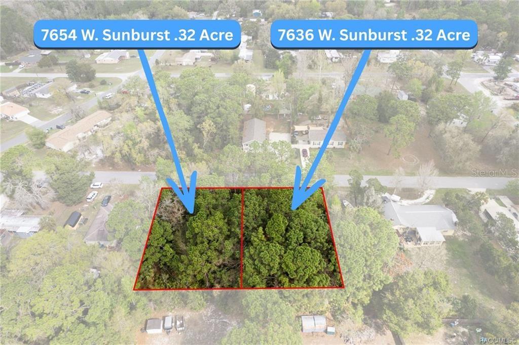 This aerial view shows two adjacent, wooded, undeveloped residential lots outlined in red — 7654 W SUNBURST LANE, HOMOSASSA, FL