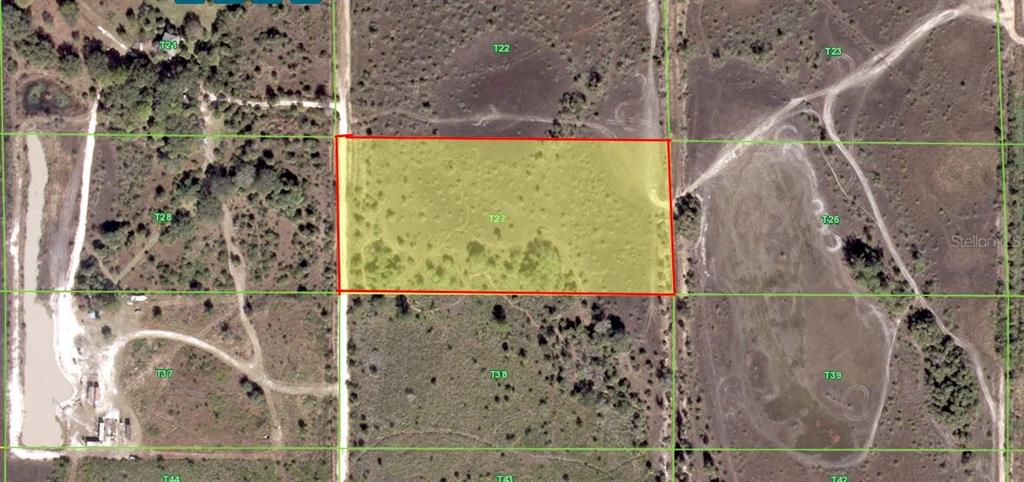 An aerial map view shows a rectangular plot of land highlighted in yellow — 50670 BERMONT ROAD, PUNTA GORDA, FL